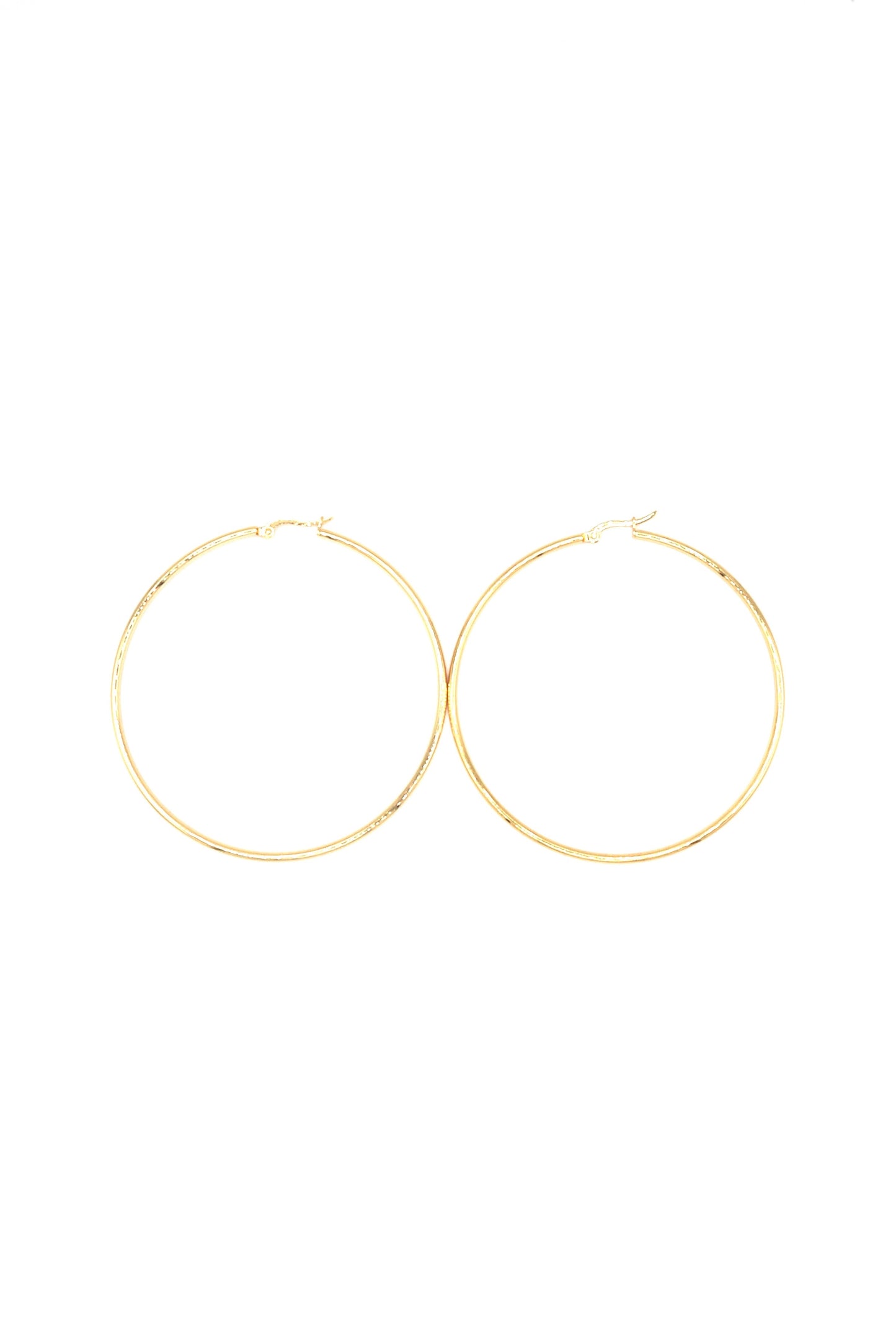 Gold plated large hoop earrings displayed flat