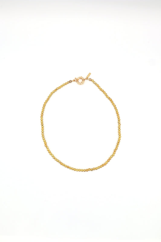 22k gold plated beaded necklace handmade on white background by Nayda De Jesus