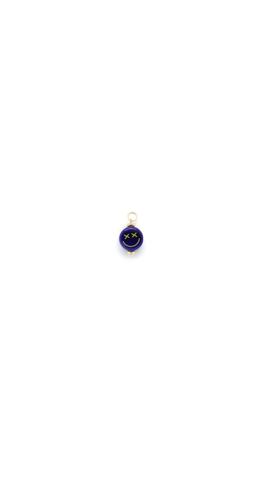 Ceramic blue crossed eyes smiley face charm by Nayda De Jesus