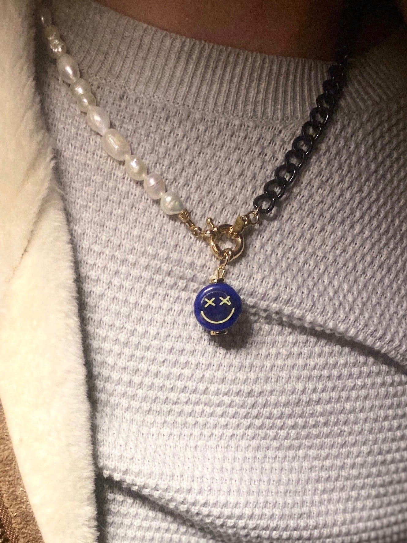 ceramic-crossed-eyed-blue-smiley-face-pendant-charm-on-18K-spring-clasp-closure-freshwater-pearls-necklace