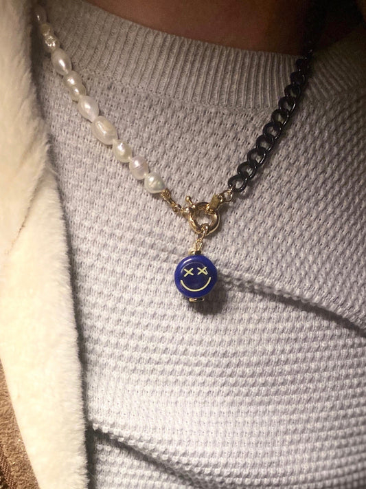 Handmade blue smiley face pendant with expressive eyes