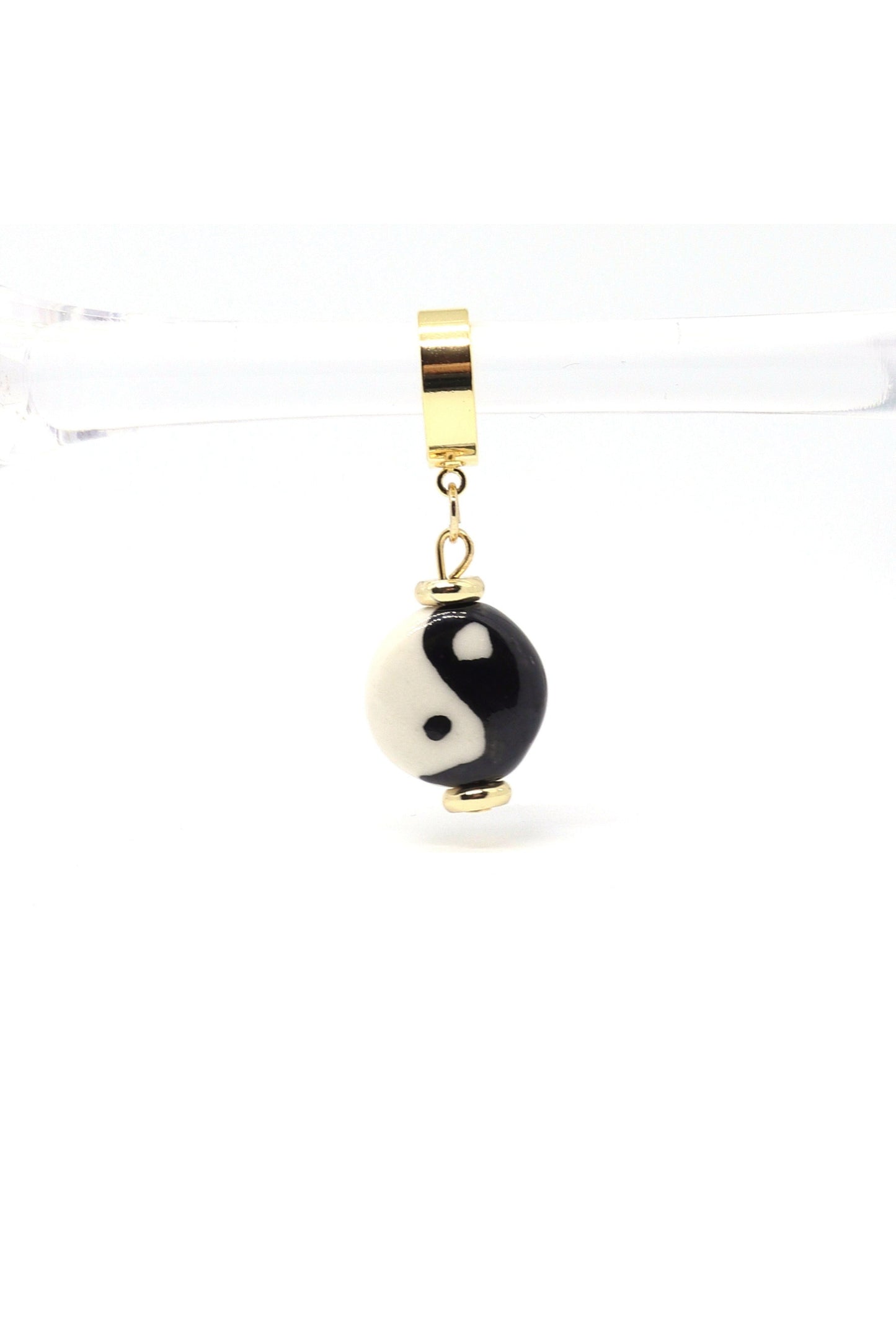 18K gold plated yin yang dangle huggies on white backround