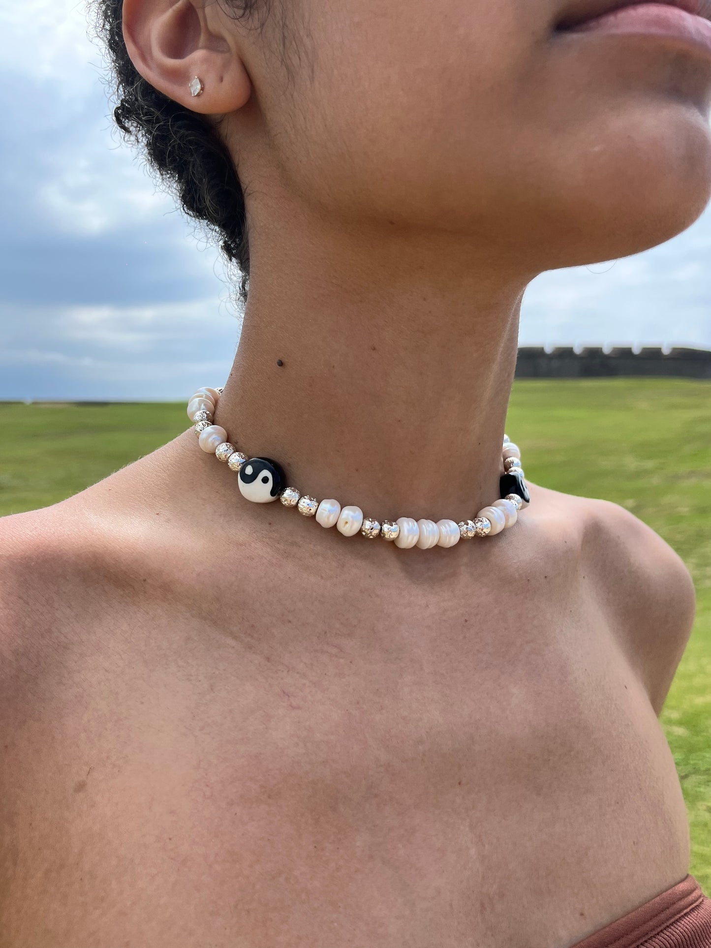 ceramic-yin-yang-freshwater-pearls-metallic-lava-beads-necklace-lifestyle-lifestyle-photo-with-model