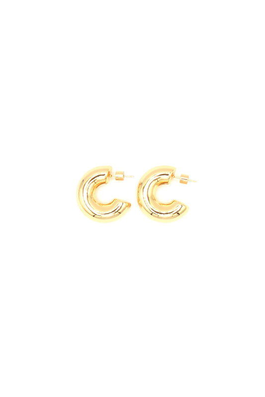 Bold statement hoop earrings in 18K gold plating on white background