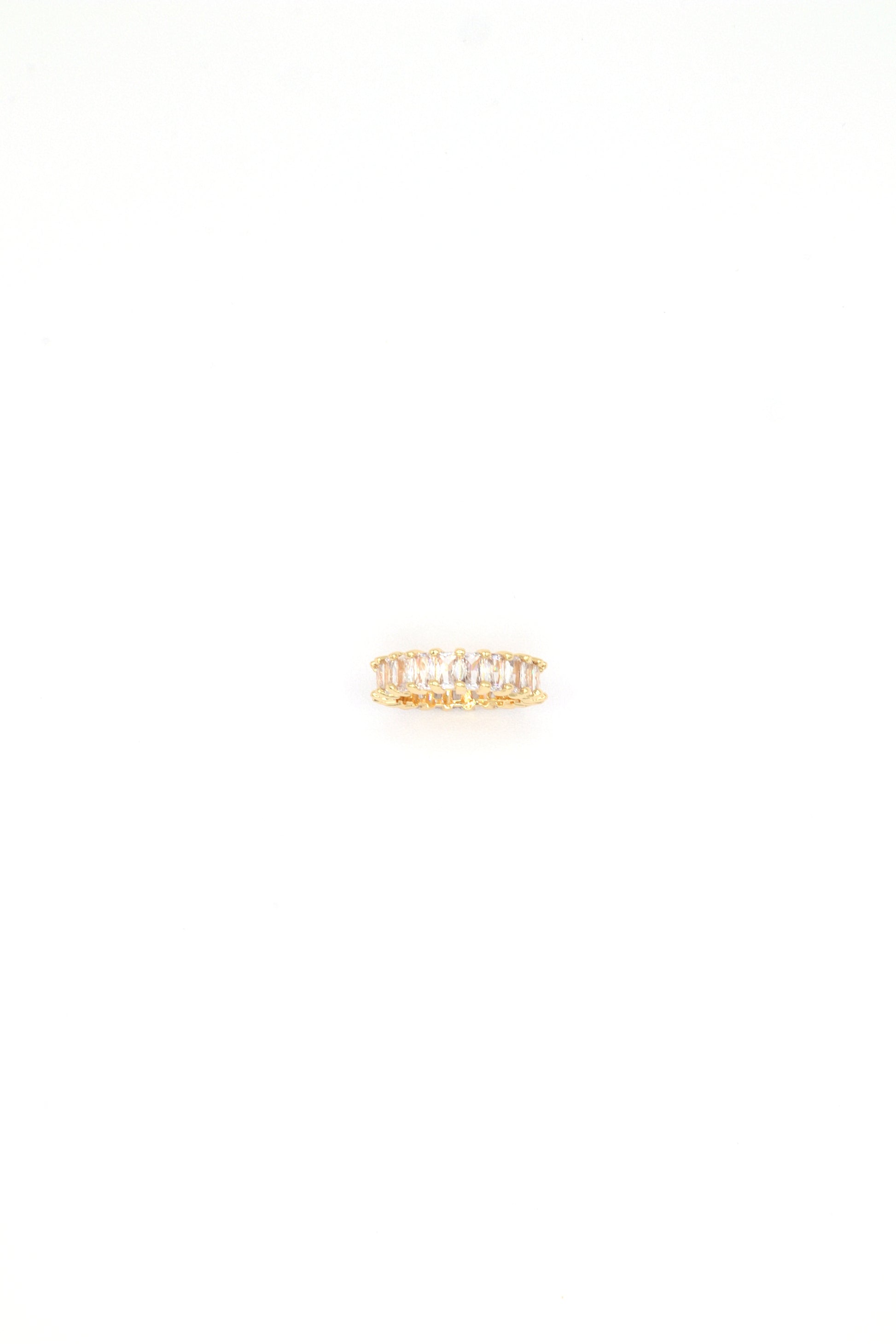 18K gold plated baguette eternity ring with cubic zirconia stones by Nayda De Jesus