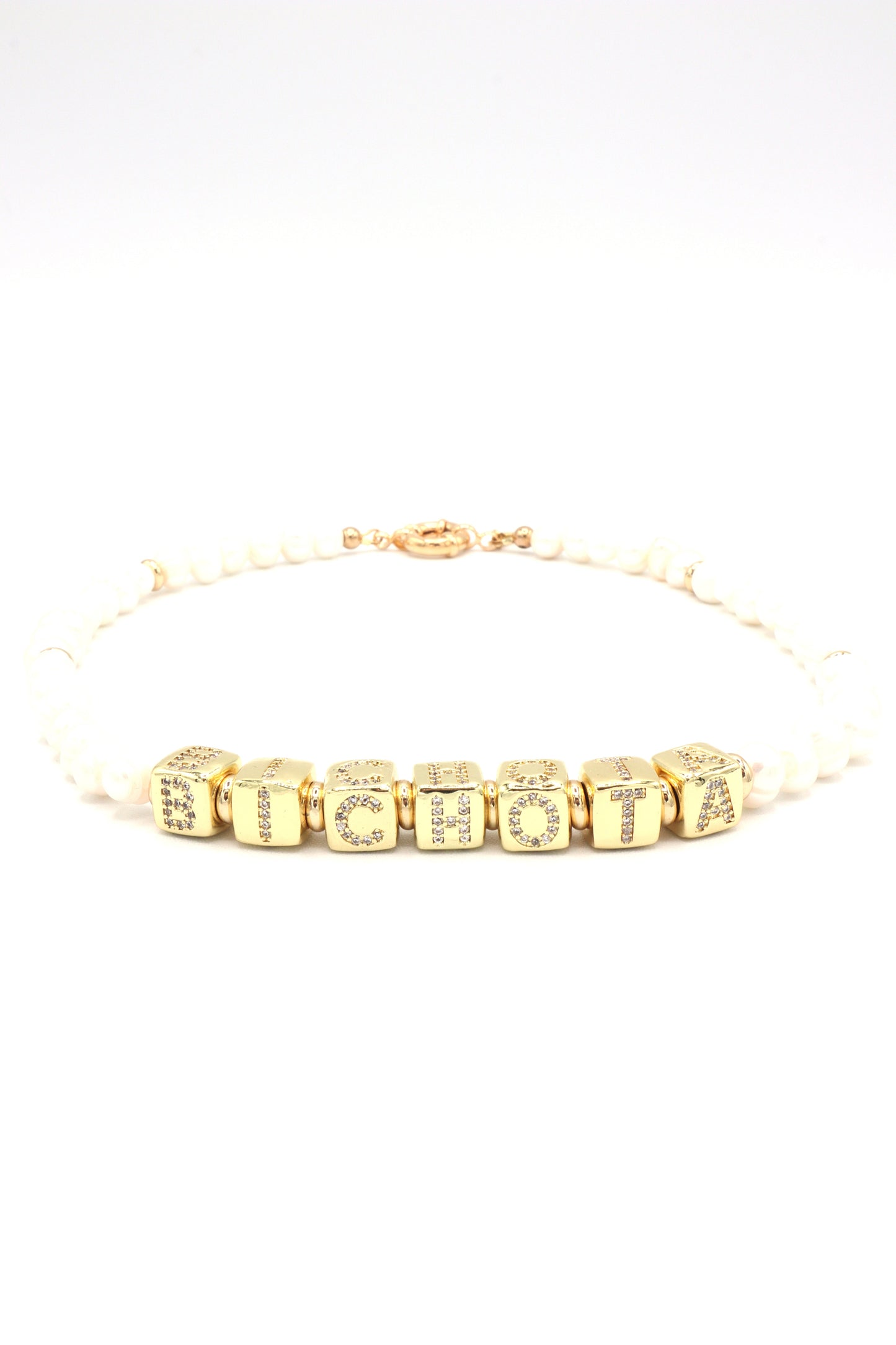 Necklace styled with ‘Bichota’ gold letters and freshwater pearls