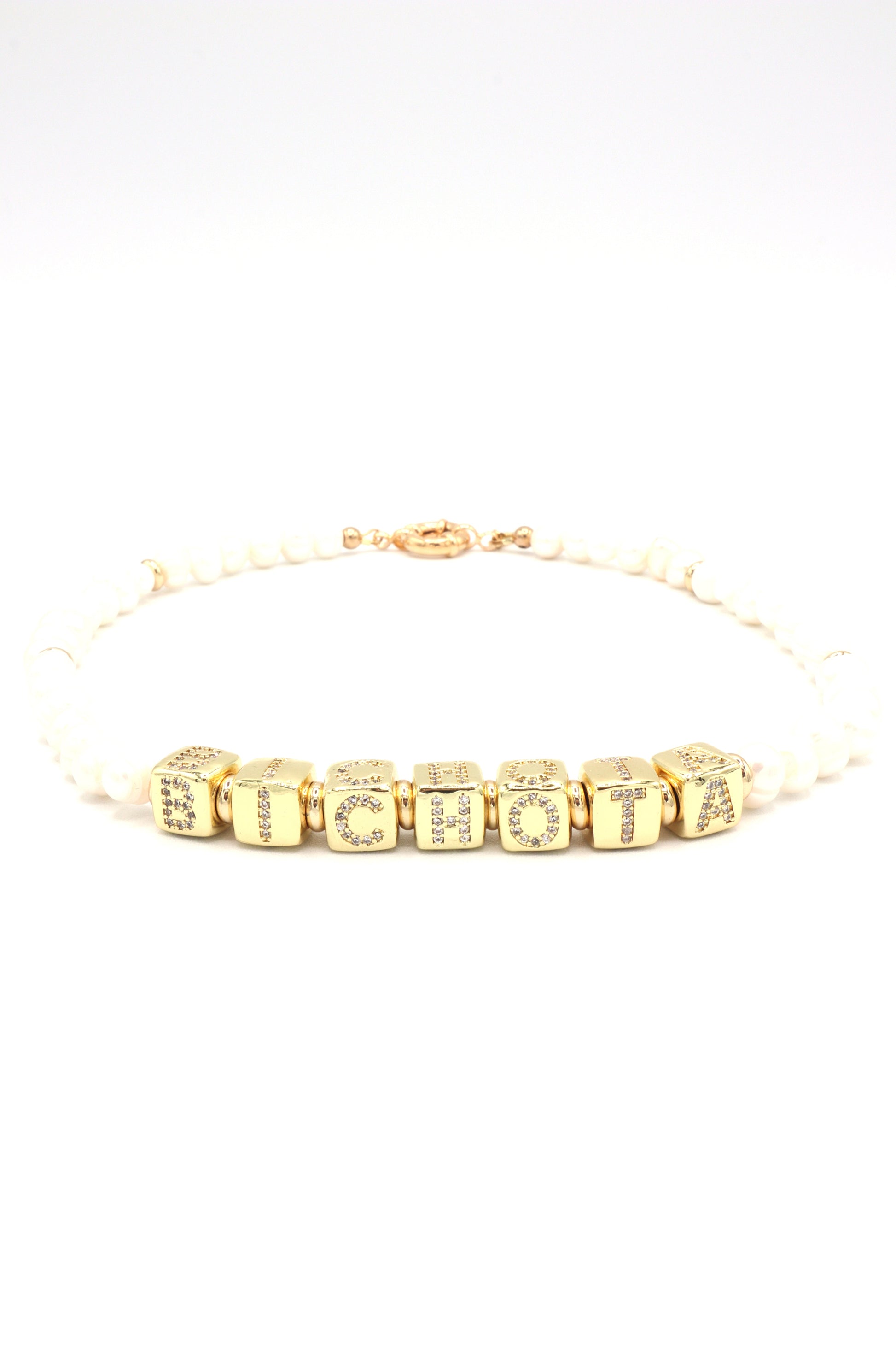 Necklace styled with ‘Bichota’ gold letters and freshwater pearls