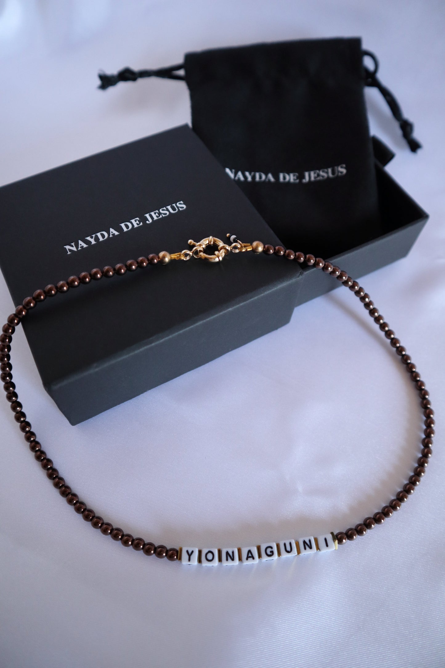 Handmade customizable glass bead necklace with name “Yonaguni”