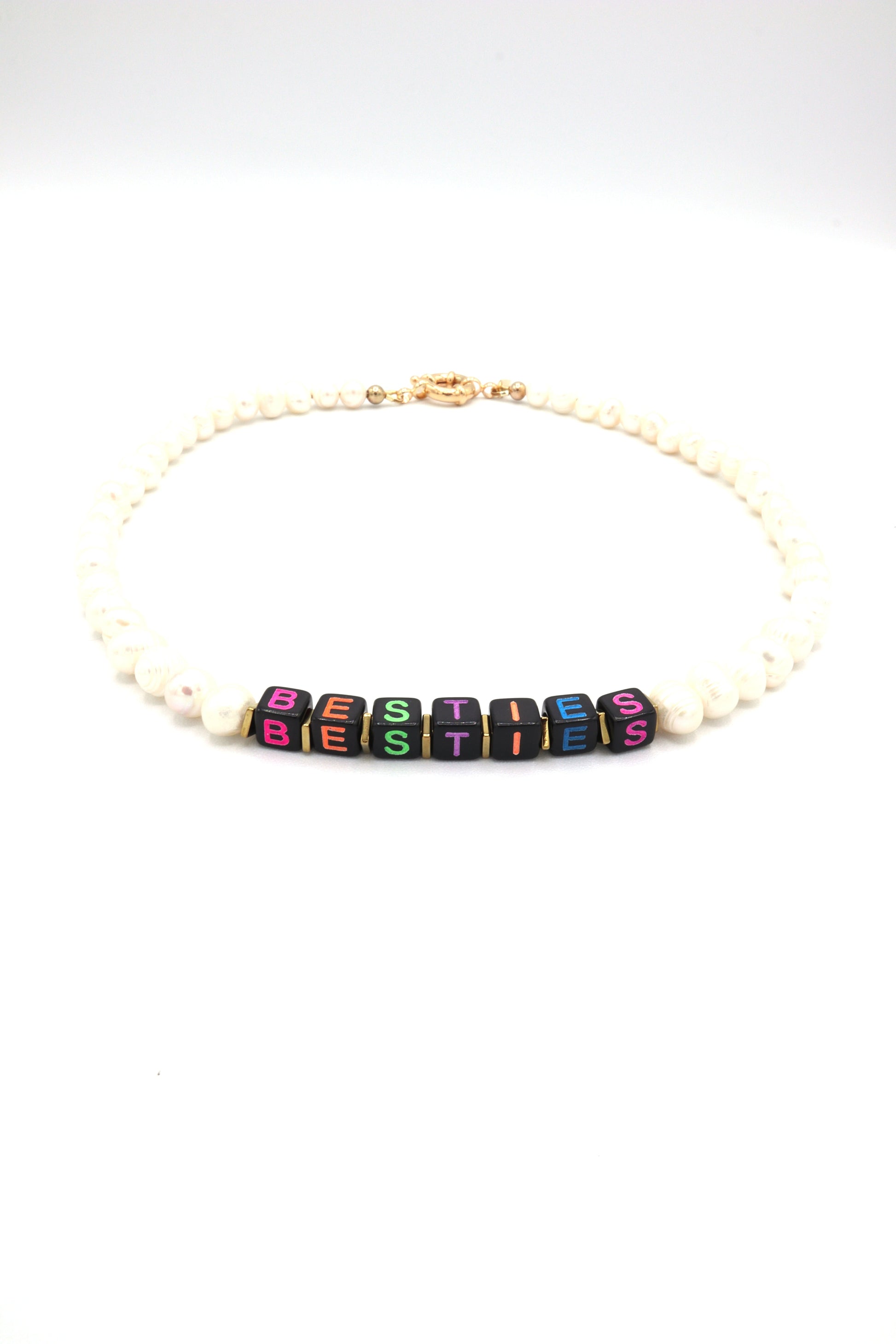 Custom freshwater pearl necklace with neon cube letters spelling 'besties'