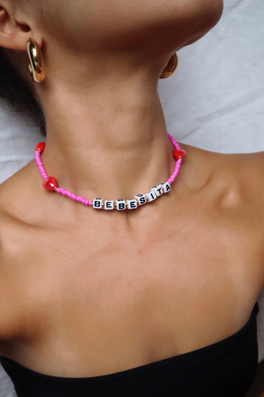 customizable-necklace-cube-letters-red-ceramic-hearts-pink-glass-beads-model-lifestyle-photo