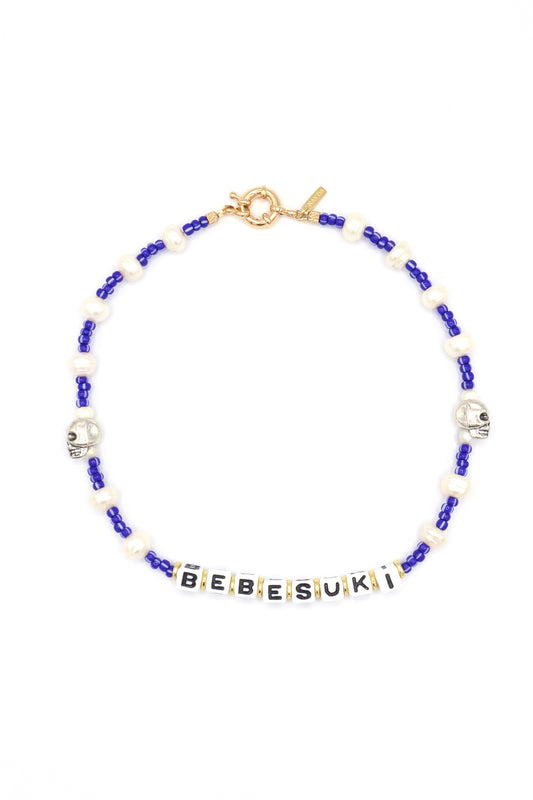 Handmade bebesuki necklace by Nayda De Jesus with pearls and skull charm