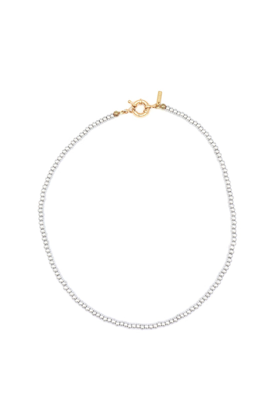 Handcrafted metallic beaded necklace displayed on flat lay