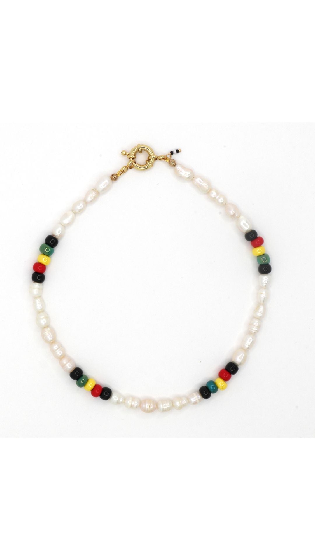 Rasta-inspired necklace with glass beads and freshwater pearls on white background by Nayda De Jesus