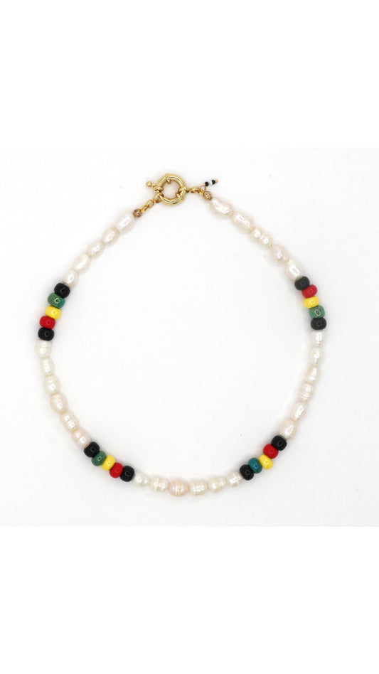 Rasta-inspired necklace with glass beads and freshwater pearls on white background by Nayda De Jesus