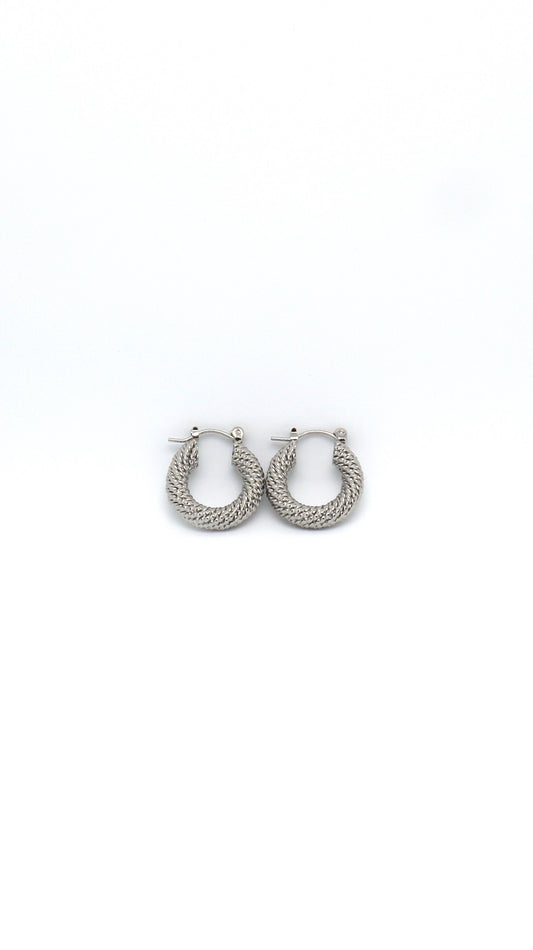 Rhodium plated 20mm twisted hoop earrings on white background