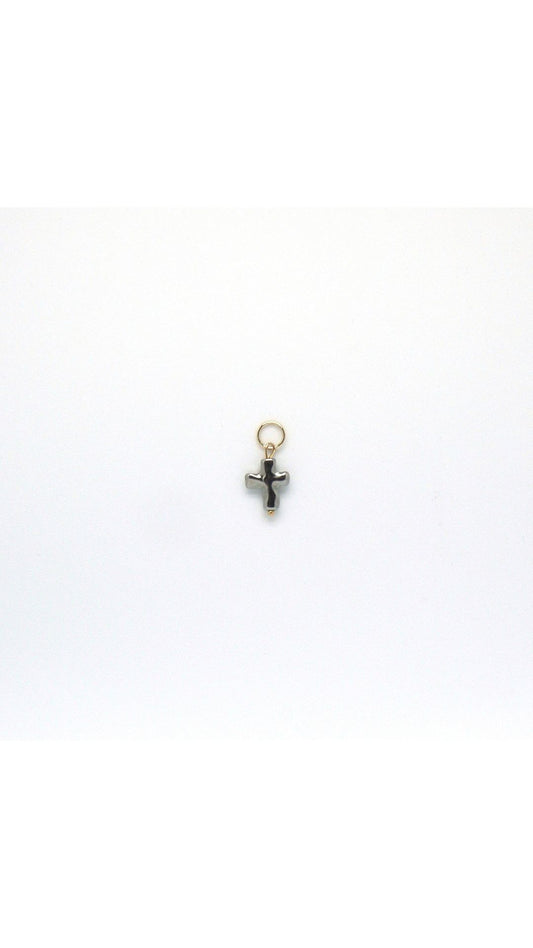 silver cross pendant charm on white background