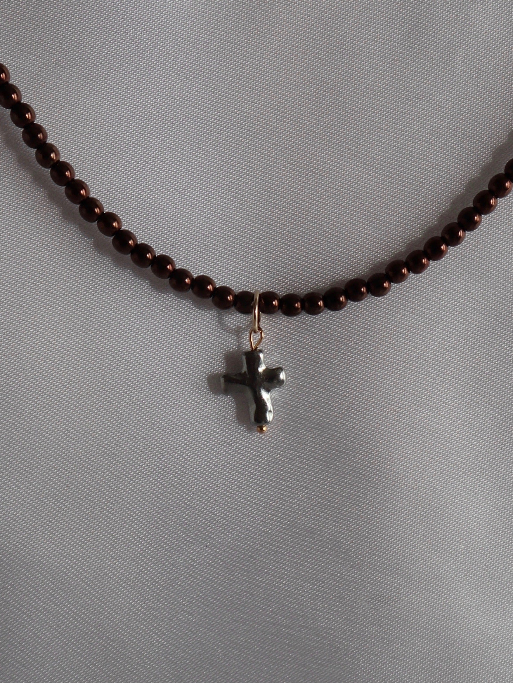 Silver cross pendant charm on necklace handmade by Nayda De Jesus