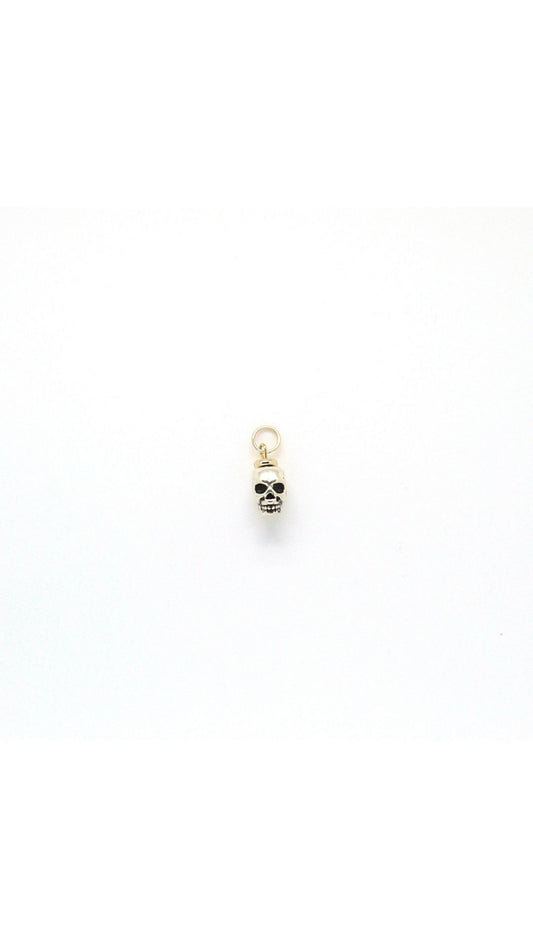 Handmade metal skull charm pendant by Nayda De Jesus