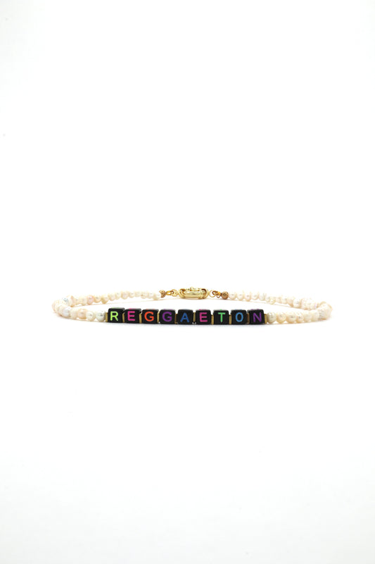 Custom neon letter necklace with freshwater pearls that says "Reggaeton"