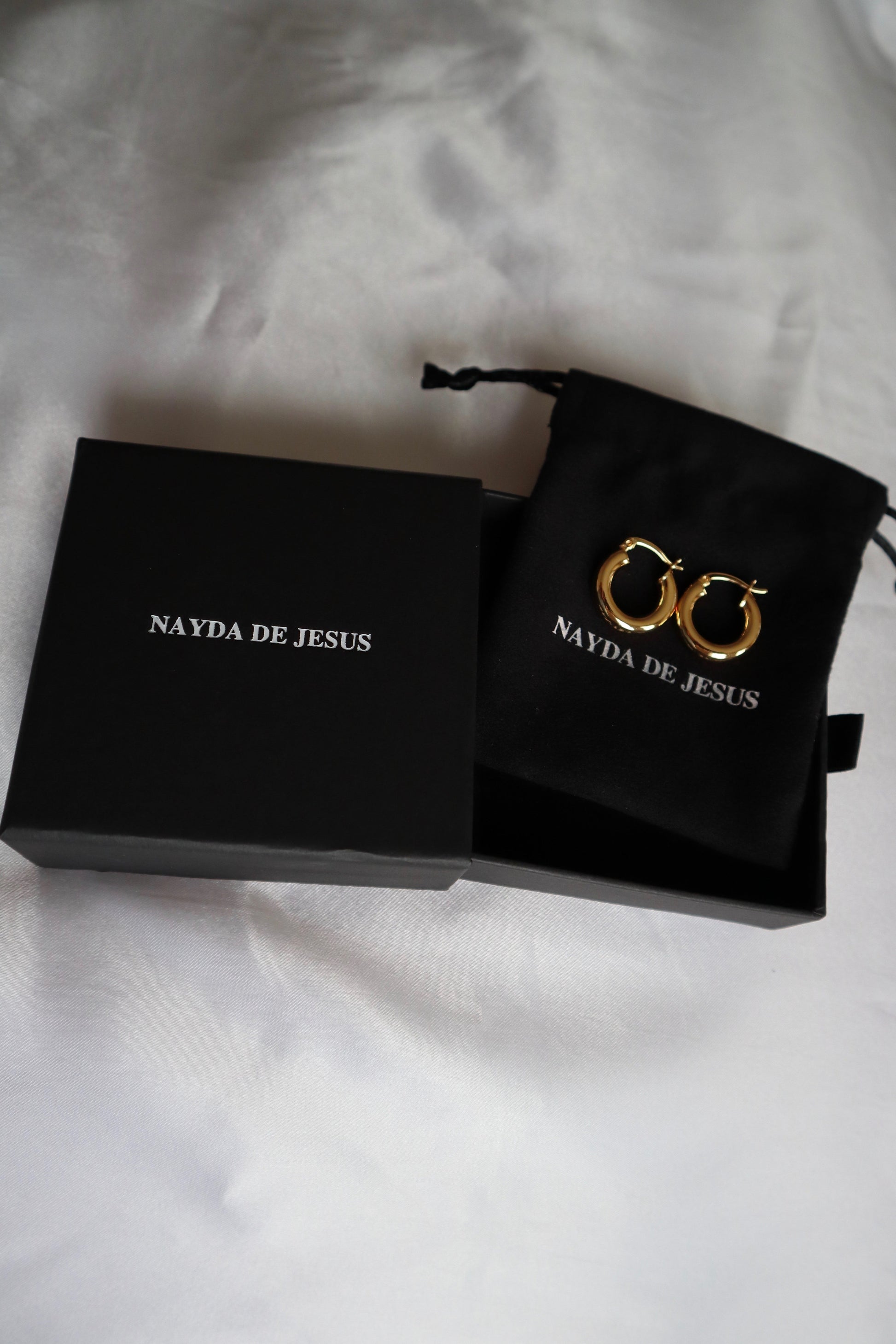 21mm 18K gold plated hoop earrings displayed on Nayda De Jesus jewelry box