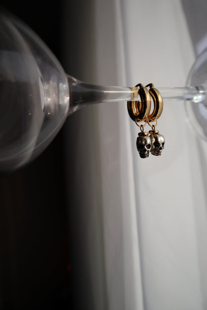 18K-gold-plated-metal-skull-earring-hoops-on-prop