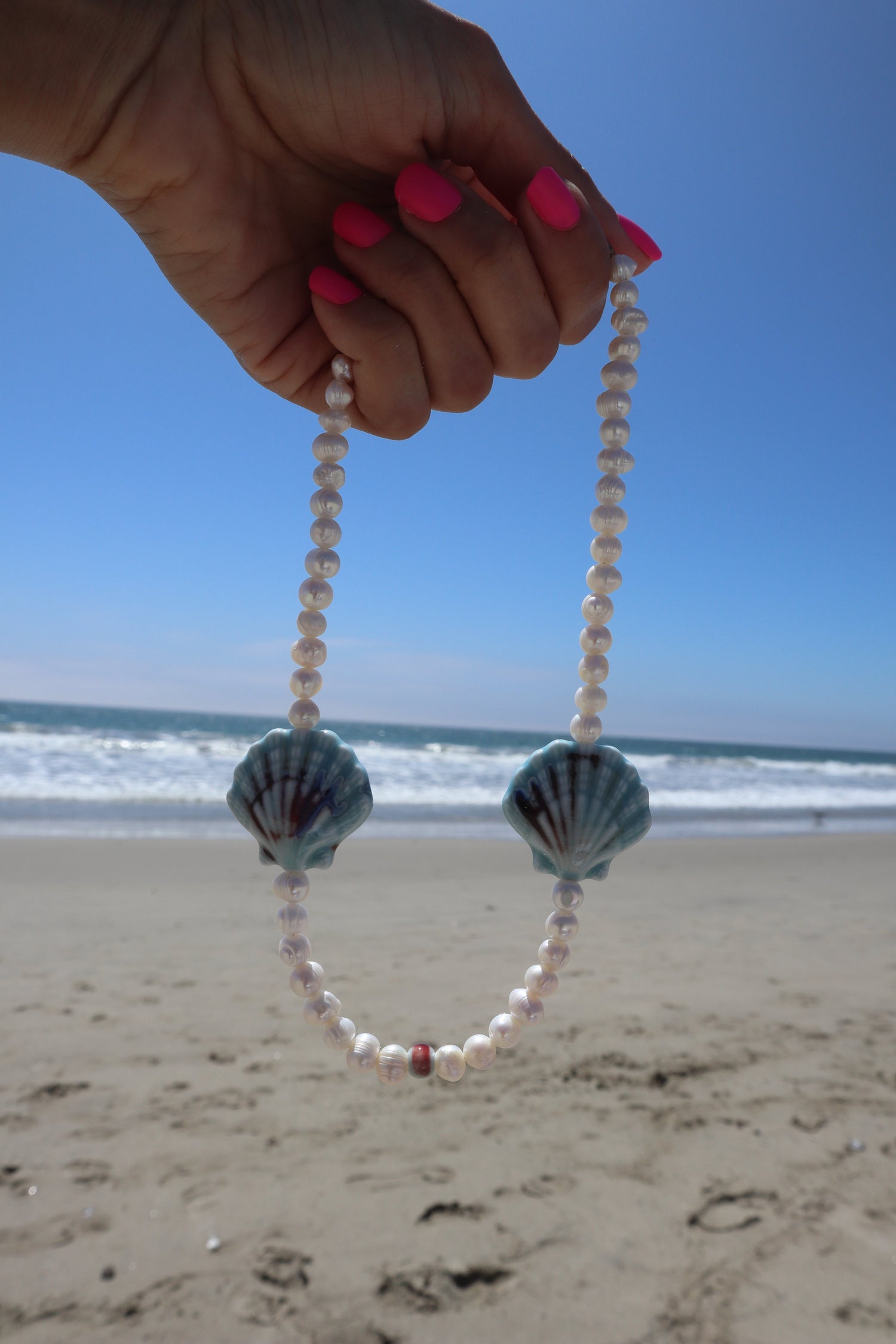 blue-ceramic-sea-shells-freshwater-pearls-necklaced-beach-photo