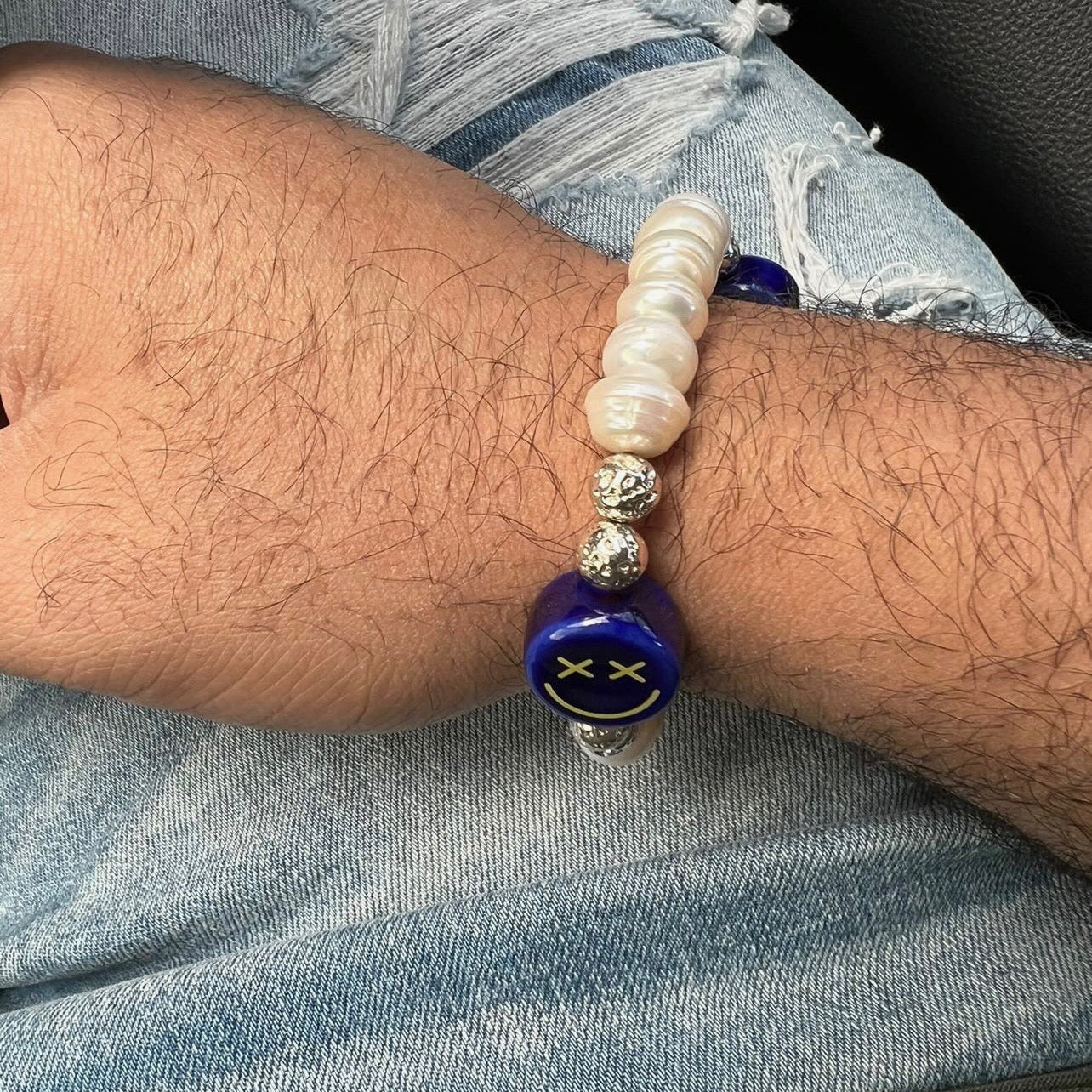    blue-cross-eyed-smiley-face-alejandro-bracelet-hand-made-with-freshwater-pearls-by-latina-nayda-de-jesus-lifestyle-photo