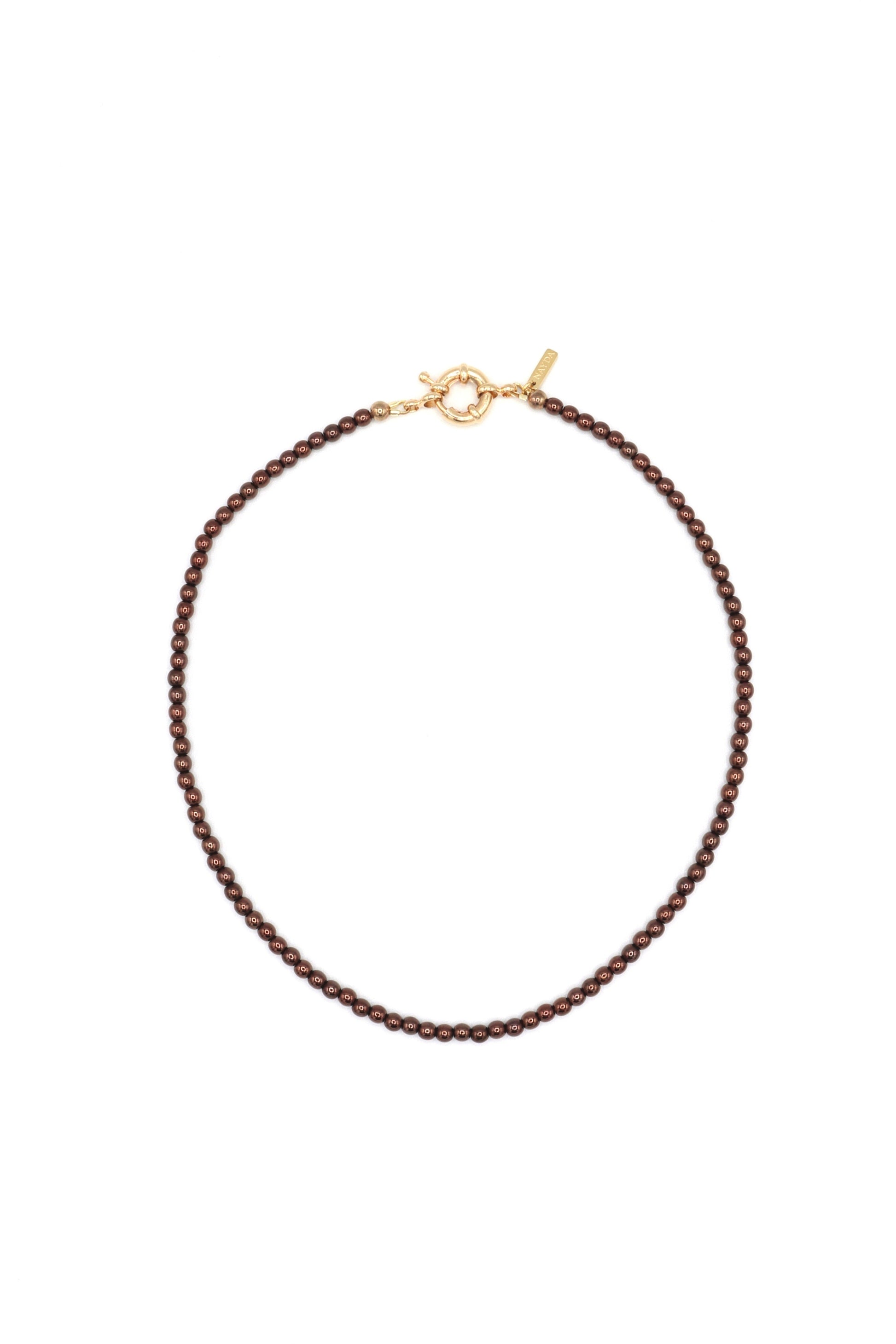 Flat lay of earthy-toned brown glass bead necklace