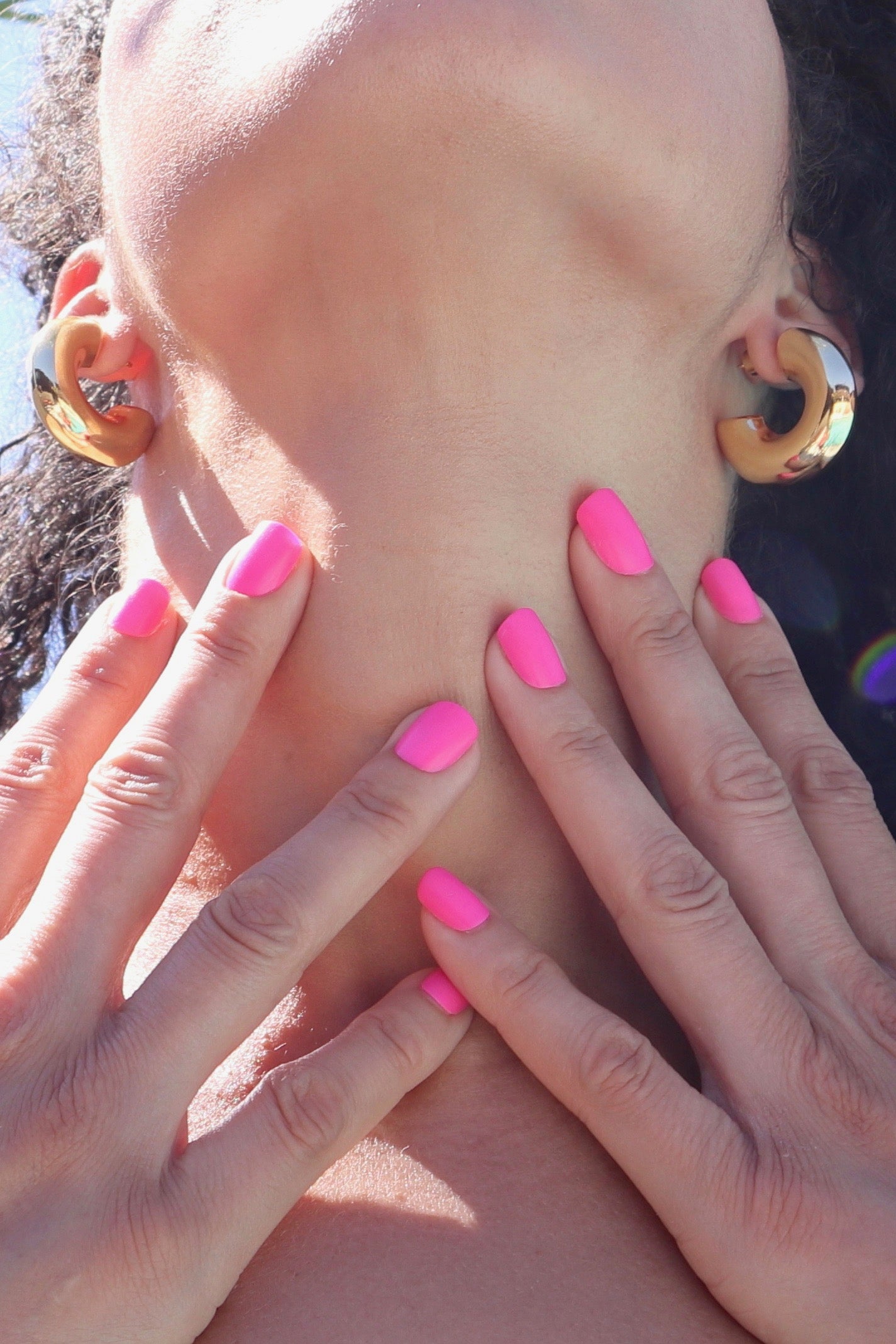 Chunky gold hoops styled on model – everyday gold earrings