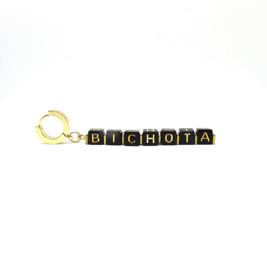 customizable-bichota-teresa-earrings-hand-made-with-black-and-gold-cube-letters-and-18-k-gold-plated-huggies-hoops-by-latina-artist-nayda-de-jesus