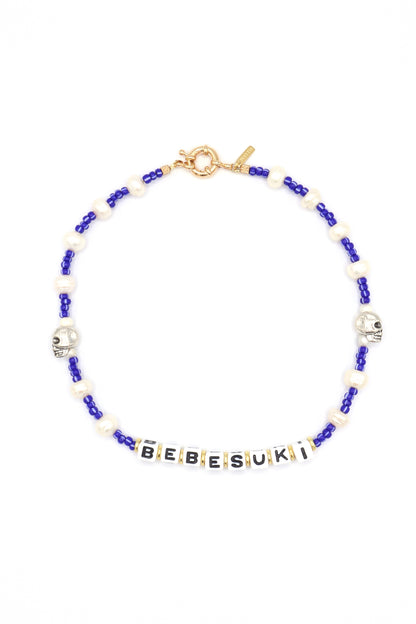 Handmade bebesuki necklace by Nayda De Jesus with pearls and skull charm