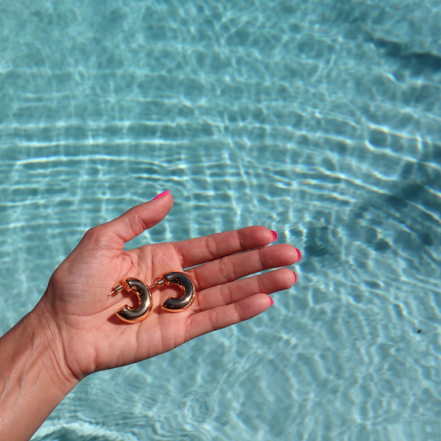 lifestyle-photo-by-pool-of-elena-chunky-gold-designer-earring-hoops-by-nayda-de-jesus