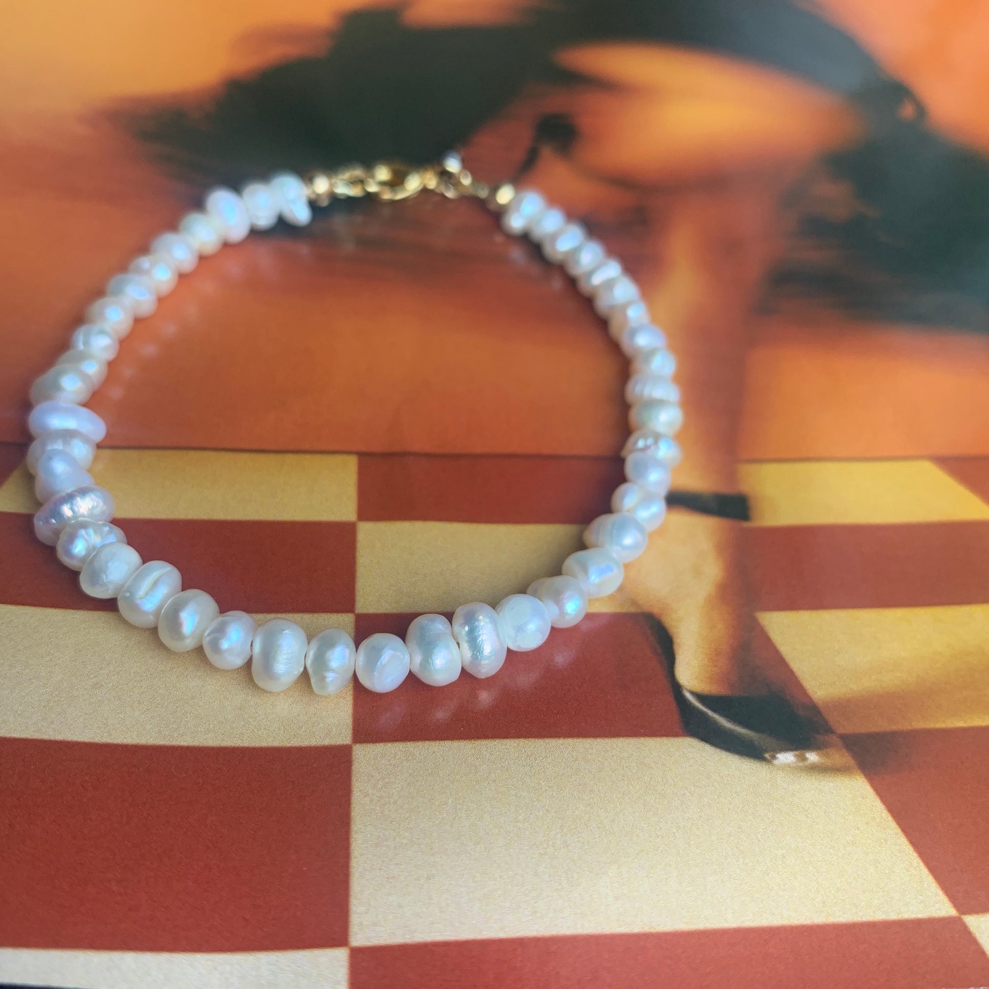 freshwater-pearls-anklet-on-magazine