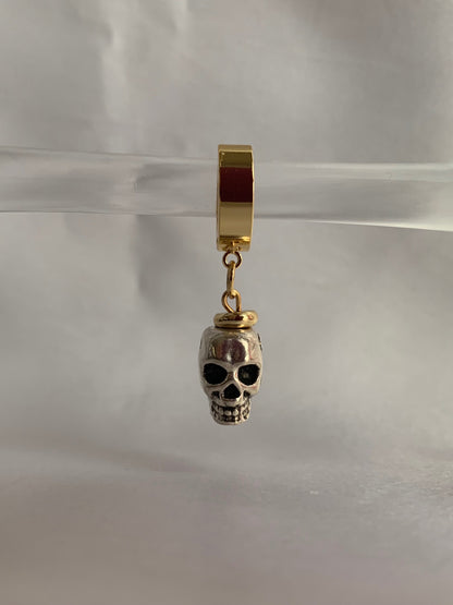 18K gold-plated skull dangle huggie hoops by Nayda De Jesus