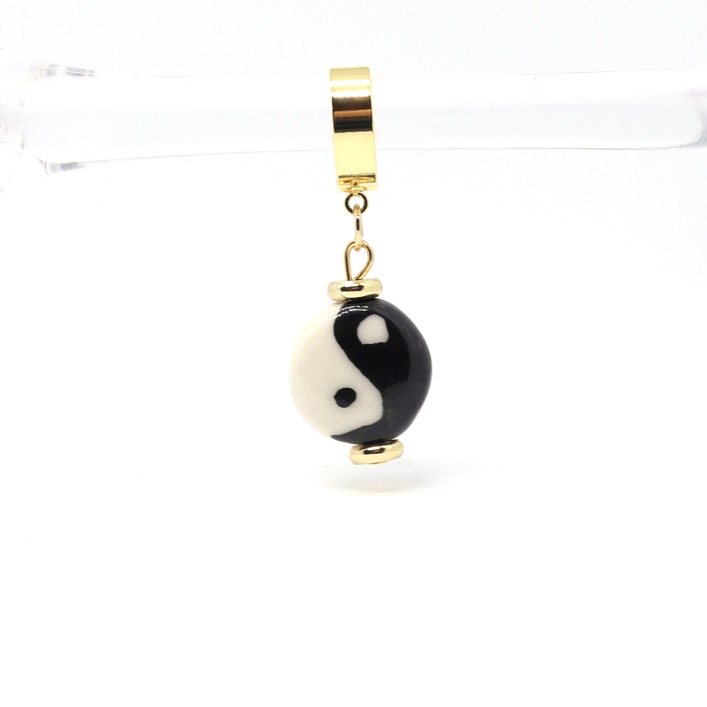 Yin-yang-daniel-earrings-huggies-hoops-by-nayda-de-jesus