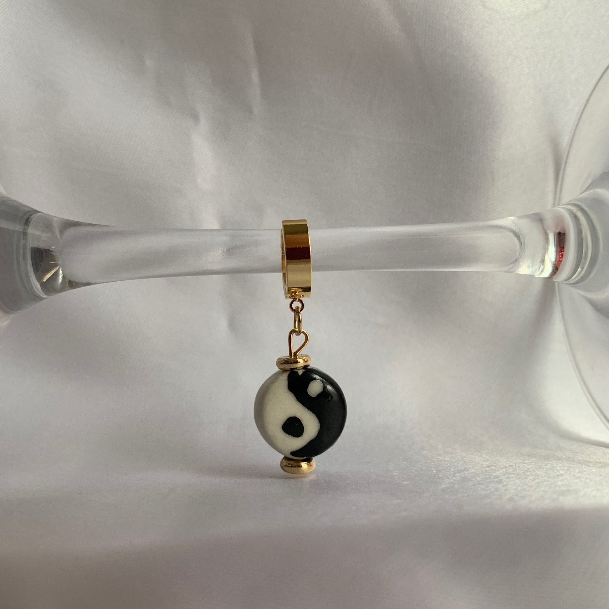 Yin-yang-daniel-earrings-huggies-hoops-by-nayda-de-jesus